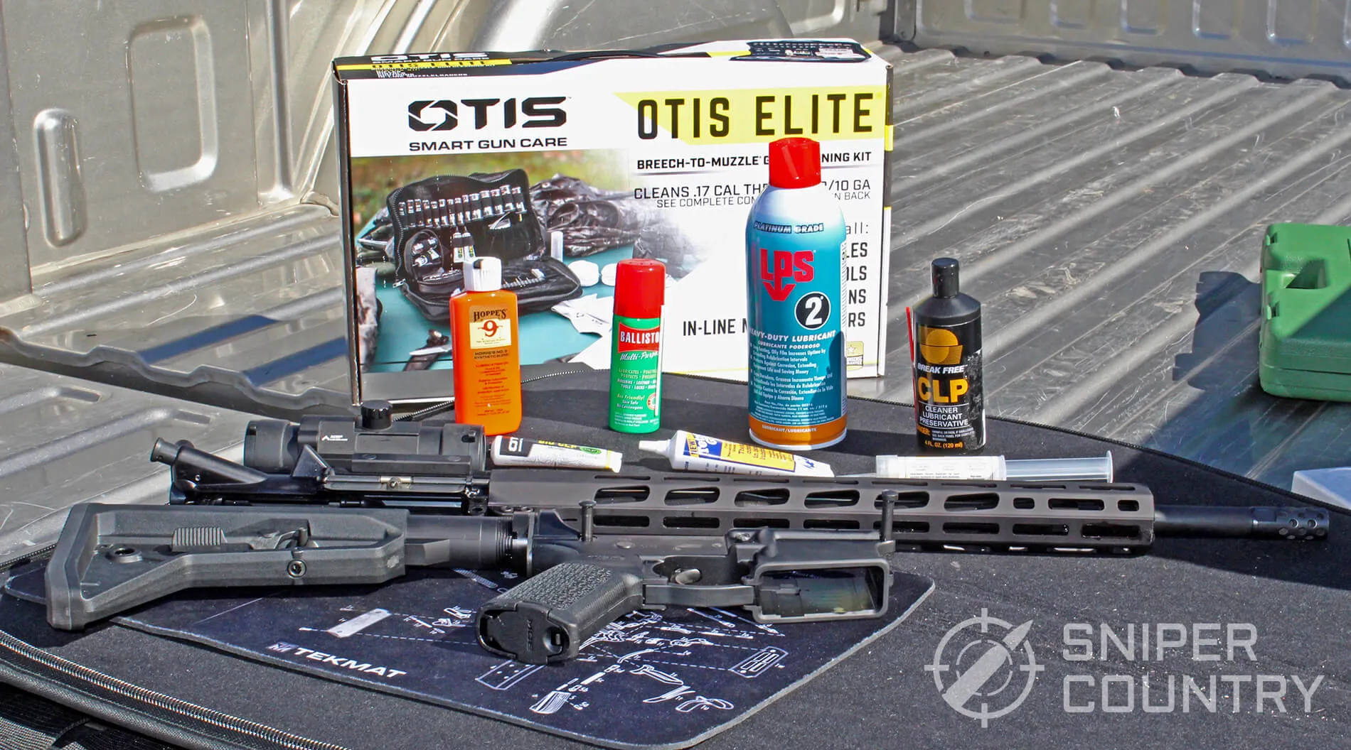 Gun oils and greases next to an AR-15