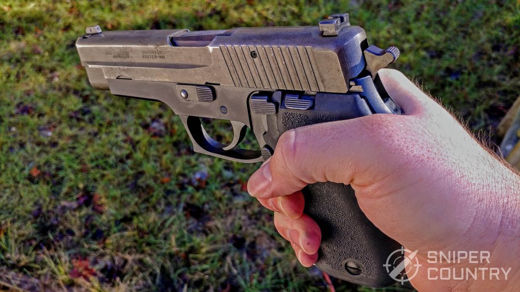 Sig Sauer P220 in hand