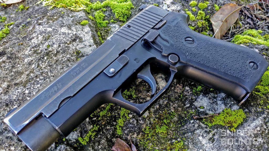 Sig Sauer P220 on rock