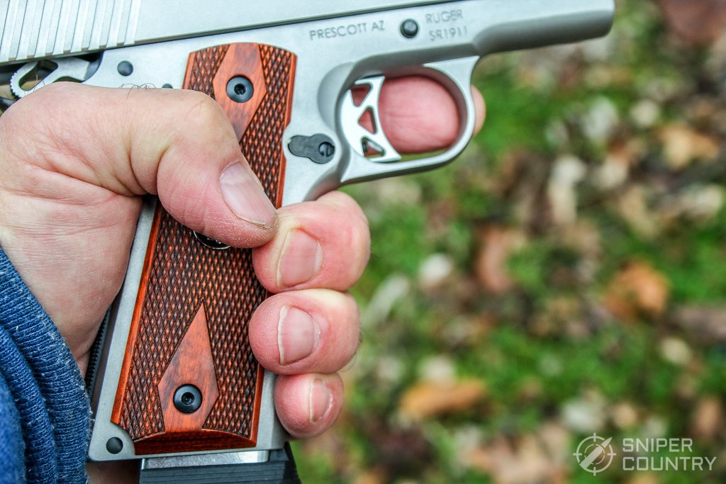 hand on grip of Ruger SR1911 Commander