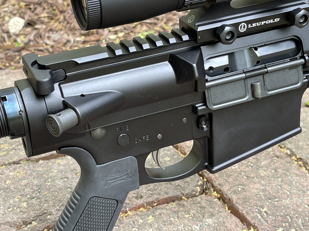 The forward assist, magazine release, and ejection port cover of the PSA AR10. Note the wide charging handle, which is well contoured and comfortable to use.