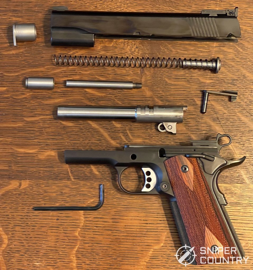 The field stripped Ed Brown Classic Custom. Most of this is standard fare for a 1911 except for the two piece recoil rod.