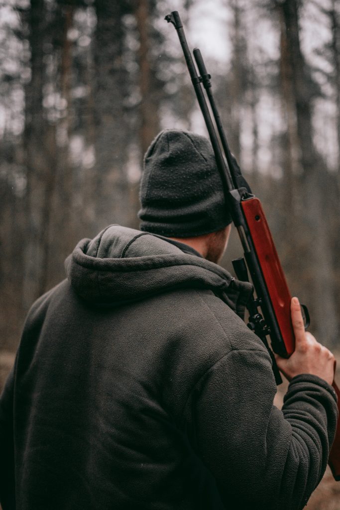 man with survival rifle