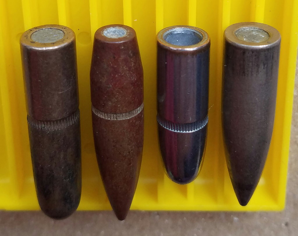 X-Treme Bullets vs. Berry's Bullets Full metal jacketed (FMJ) bullets with exposed lead on the base.